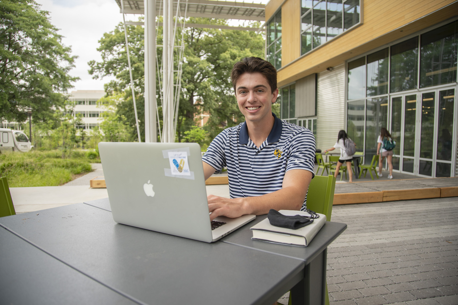 Student outside the Kendeda Building