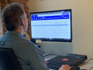 A user working with accessible browser-based Highcharts Sonification Studio software.